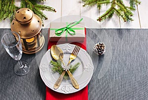 Christmas serving table. Traditional festive decoration background top view. Cutlery utensils beautiful plates decorative elements