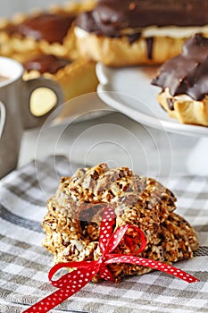 Christmas sesame cookies with red, dotted ribbon