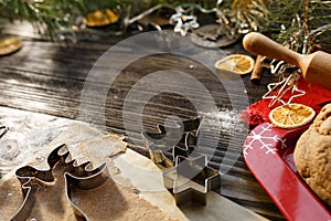 Christmas shape for baking: deer, star and christmas tree. Around Christmas mood on dark wood background. Copy space, flat lay.