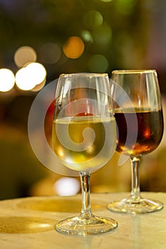 Christmas sherry wine, dry or sweet jerez fortified wine in glasses and street lights, Jerez de la Frontera, Andalusia, Spain photo