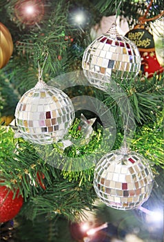 Christmas shiny toys balls on the tree for the new year holiday