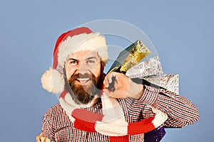 Christmas shopping concept. Guy or hipster shopper in red hat