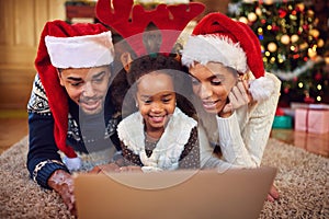 Christmas shopping online- family surfing on computer
