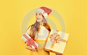 Christmas shopping online. time for discount. smiling kid hold purchase. presents and gifts from santa claus. small girl