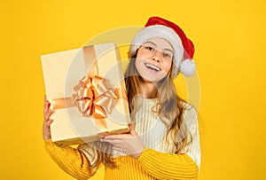 Christmas shopping online. time for discount. smiling kid hold purchase. presents and gifts from santa claus. small girl