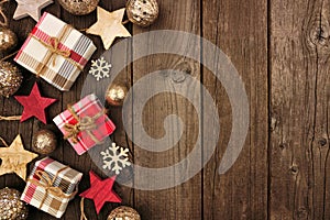 Christmas side border of gifts and rustic decorations on wood