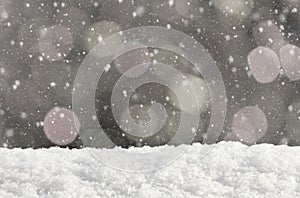 Christmas silver background with bokeh lights and falling snow