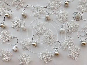 Christmas  silver balls on white  background with snowflakes. Christmas concept. copy space