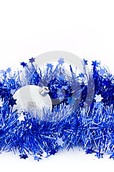 Christmas silver bals in blue tinsel