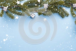 Christmas silver decorations on blue background