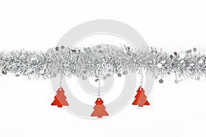 Christmas silver garland with red trees paper on white background