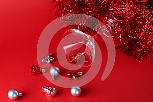 Christmas silver and red toys in a glass goblet