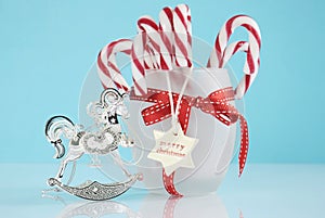 Christmas silver vintage rocking horse tree ornament and jar of candy canes