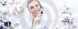 Christmas smiling woman with headset on christmas balls