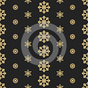 Christmas snow background. Golden snowflakes on a black background. Winter seamless pattern.