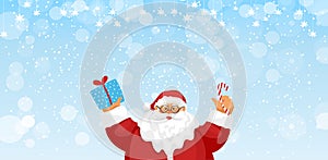 The Christmas snow banner with copy space, Santa Claus with gift and candy. Winter blue background for the new year