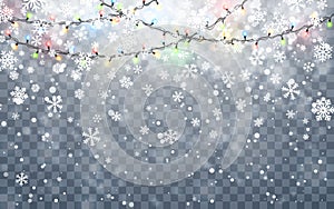 Christmas snow. Falling white snowflakes on dark background. Xmas Color garland, festive decorations. Glowing christmas lights.