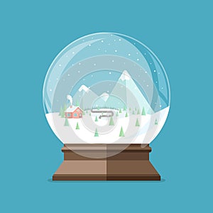 Christmas snow globe with house in the forest and mountains