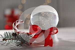 Christmas snow globe with red bow