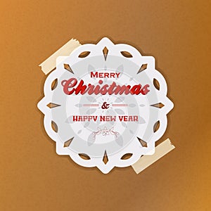 Christmas snowflake with sellotape on brown paper