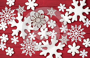 Christmas Snowflakes Background on Rustic Red Wood Boards photo from an above, looking-down view in Horizontal that can be used ve