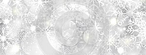 Christmas snowflakes banner. Bright snow background with snowflakes in different shapes. Winter holiday template. New