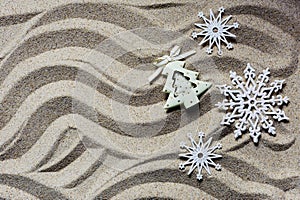 Christmas snowflakes in beach sand place for kopiroanija