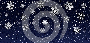 Christmas snowflakes on blue background. Snowfall on winter. White snow stars for xmas holidays. Abstract frozen pattern. Glow