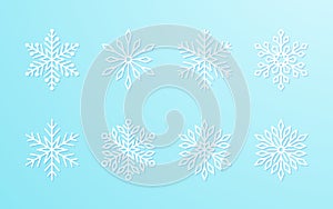 Christmas snowflakes collection white isolated on blue gradient background. Cute snow icons with intricate silhouette