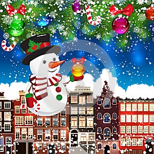 Christmas snowman on the background of snow-covered streets.