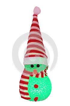 Christmas snowman isolated. Close-up of a green illuminated happy cute winter snowman with red white striped hat and scarf