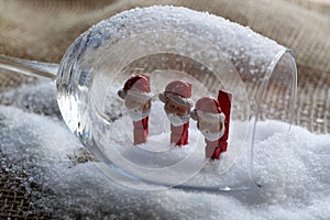 Christmas snowmen on clothespins, inside a glass goblet