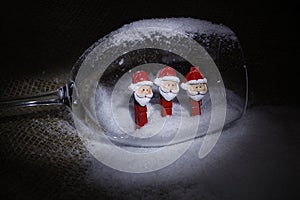 Christmas snowmen on clothespins, inside a glass goblet