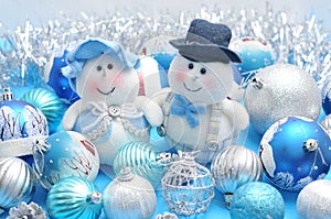 Christmas snowmen surrounded by New Year`s toys