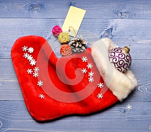 Christmas sock toned wood background top view. Fill sock with gifts or presents. Celebrate christmas. Small items