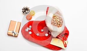 Christmas sock white background top view. Small items stocking stuffers or fillers little christmas gifts. Fill sock