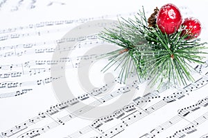 Christmas song, xmas tree branch on music sheet