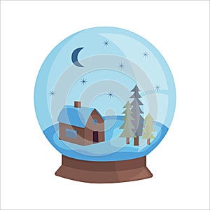 Christmas souvenir snow globe with forest house inside.