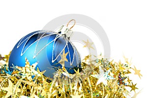 Christmas sphere of dark blue color and tinsel