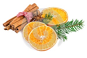 Christmas spices with cinnamon sticks and dried orange slices on white