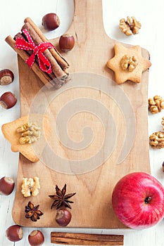 Christmas spices, nuts on cutting board