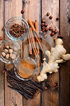 Christmas spices on a wood background