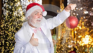 Christmas spirit. Christmas decoration. Santa Claus. Mature man with white beard. Bearded grandfather senior man