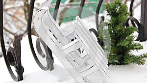 Christmas spirit. Christmas decorations in the snow. Decorative white sleigh
