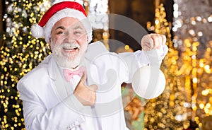 Christmas spirit. Mature man with white beard. Bearded grandfather senior man celebrate christmas. Kind grandpa with toy