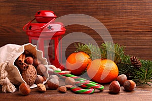 Christmas spirit: nuts, tangerines, Christmas tree, nuts, a flashligh