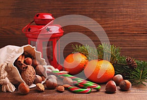 Christmas spirit: nuts, tangerines, Christmas tree, nuts, a flashlight