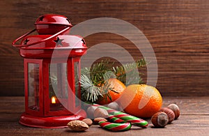 Christmas spirit: nuts, tangerines, Christmas tree, nuts, a flashlight