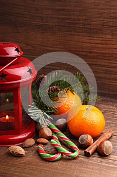 Christmas spirit: nuts, tangerines, Christmas tree, nuts, a flashlight