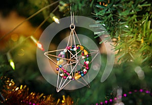 Christmas star baubles on tree